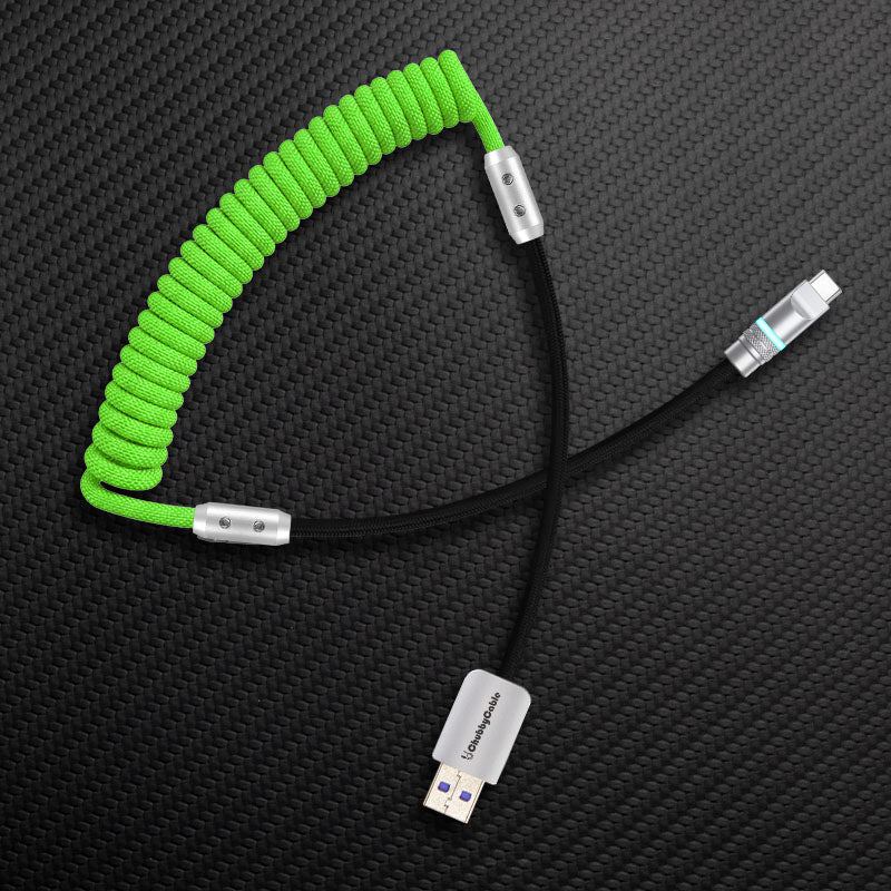 Green and black coiled USB-A to USB-C cable