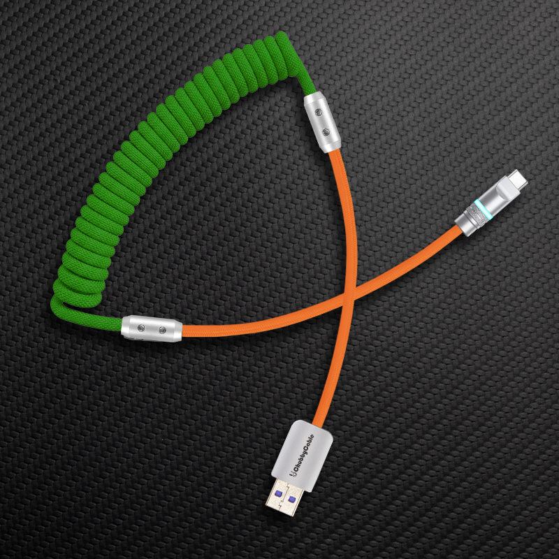 Green coiled cable with orange straight segment and USB-A to USB-C connector