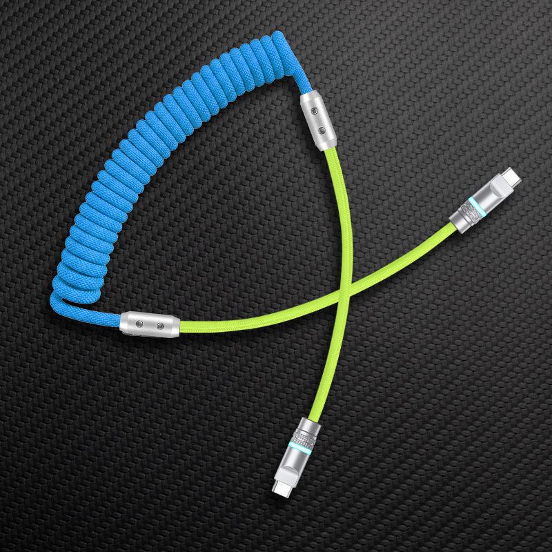 Blue coiled cable with lime green straight segment and USB-C to USB-C connectors
