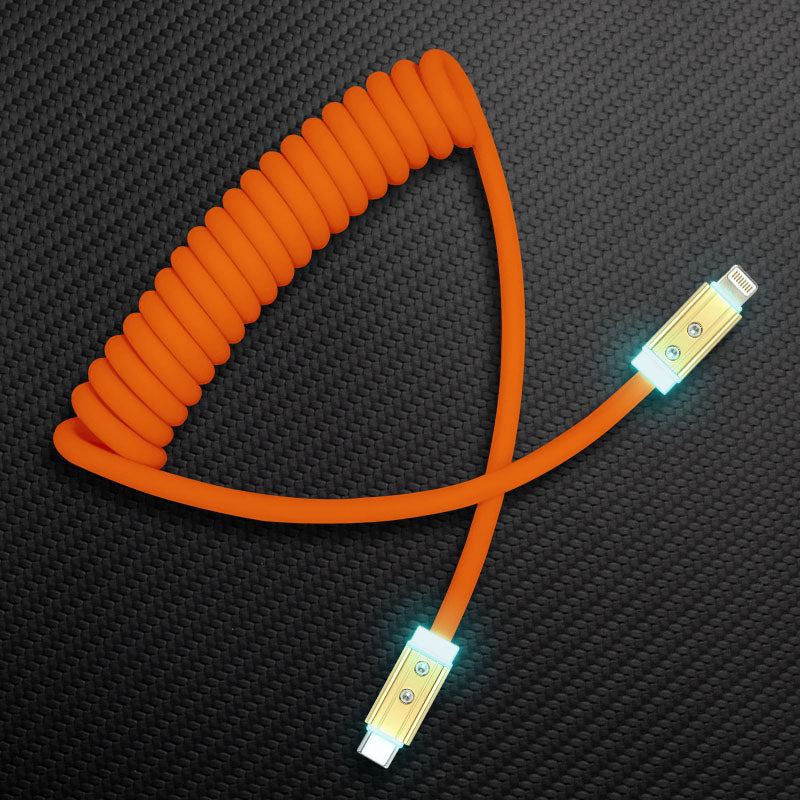 Orange coiled USB-C to Lightning fast charging cable