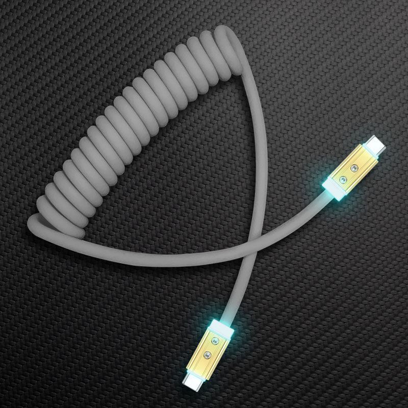 Grey coiled USB-C to USB-C charging cable with LED light