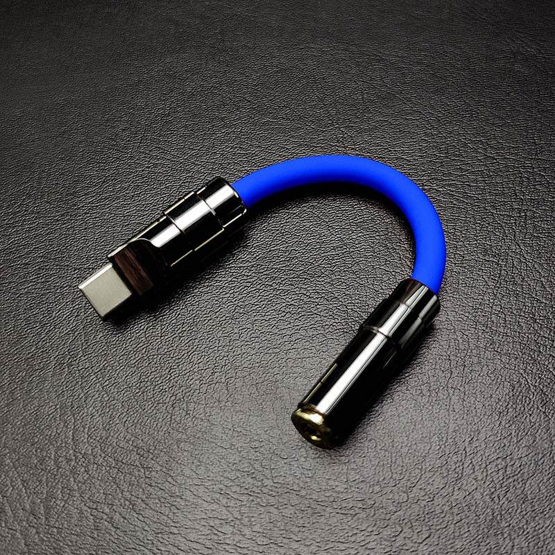 Royal blue USB-C to 3.5mm headphone jack adapter with gunmetal hardware.