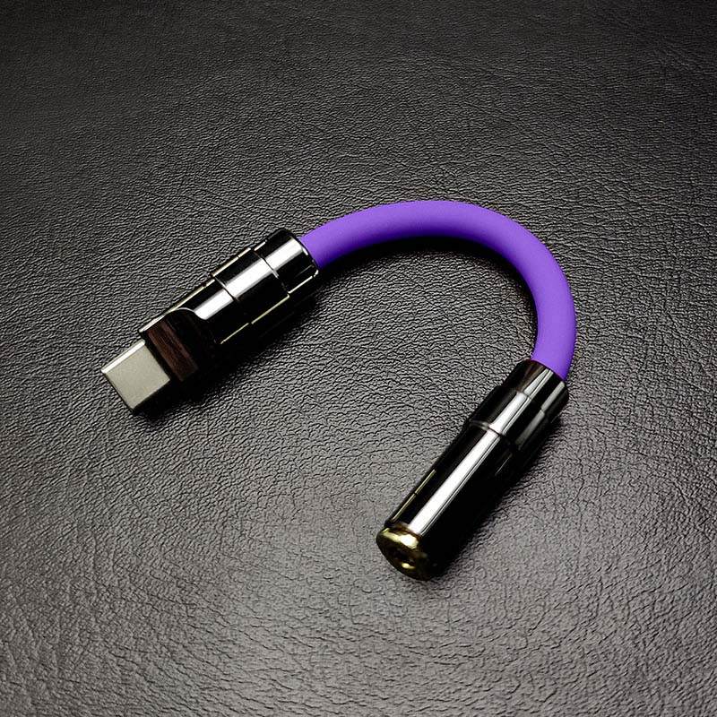 Purple USB-C to 3.5mm headphone jack adapter with black metallic shell
