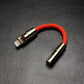 Red Lightning to 3.5mm headphone jack adapter with gold metallic shell