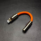 Orange Lightning to 3.5mm headphone jack adapter with gold metallic shell