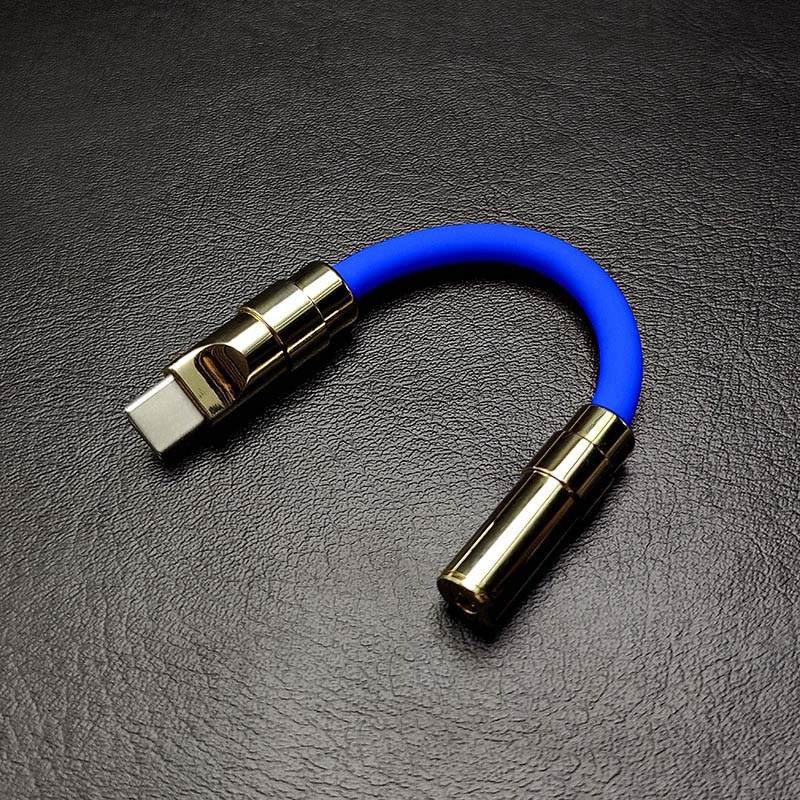 Blue USB-C to 3.5mm headphone jack adapter with gold metallic shell