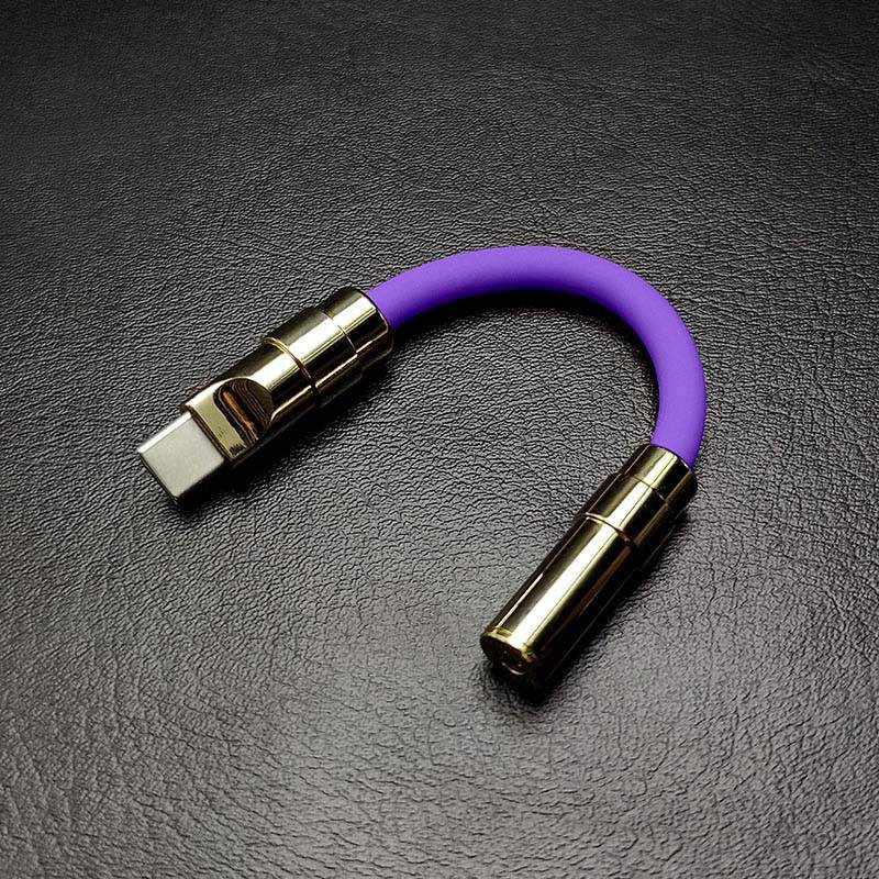 Purple USB-C to 3.5mm headphone jack adapter with gold metallic shell