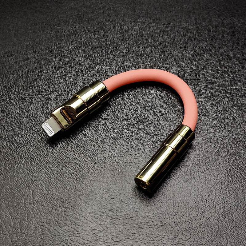 Pink Lightning to 3.5mm headphone jack adapter with gold finish