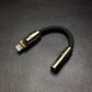 Black Lightning to 3.5mm headphone jack adapter with gold finish