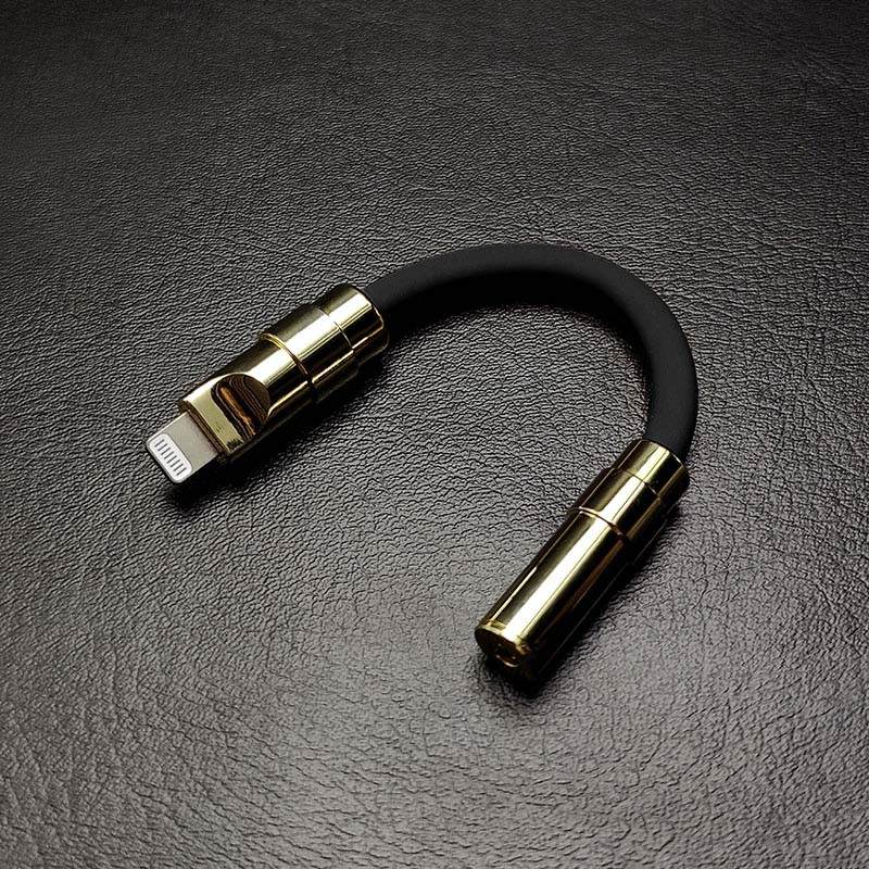 Black Lightning to 3.5mm headphone jack adapter with gold finish