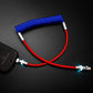 Red and blue coiled USB charging cable with glowing tip