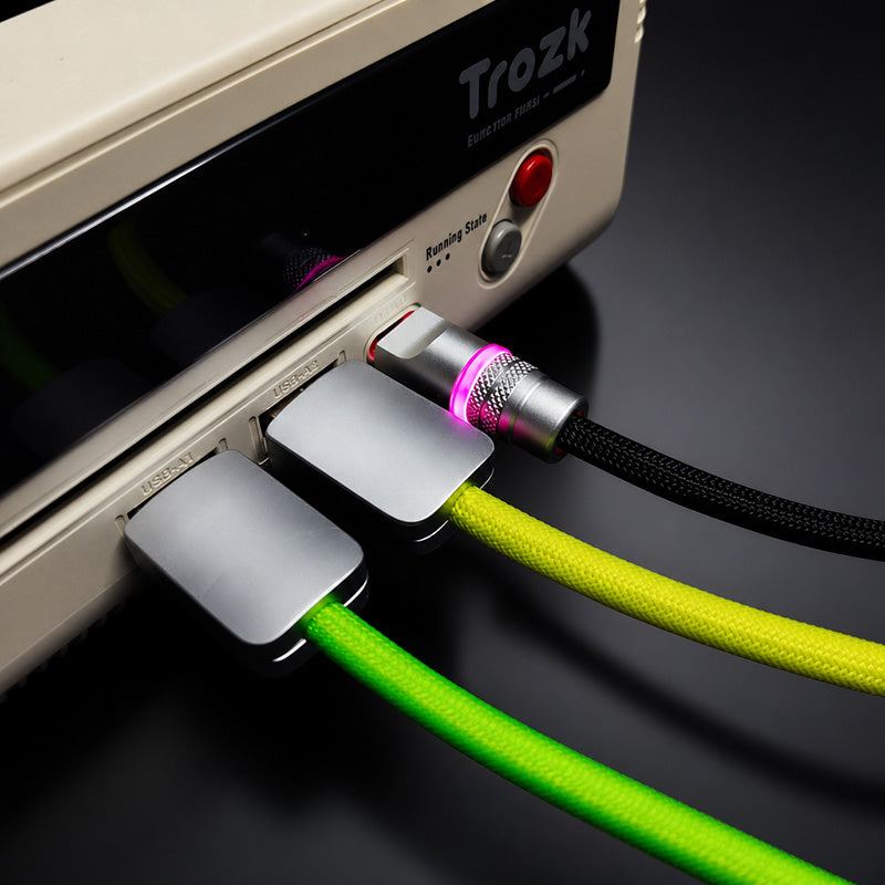 Glowing coiled USB-C cables connected to docking station